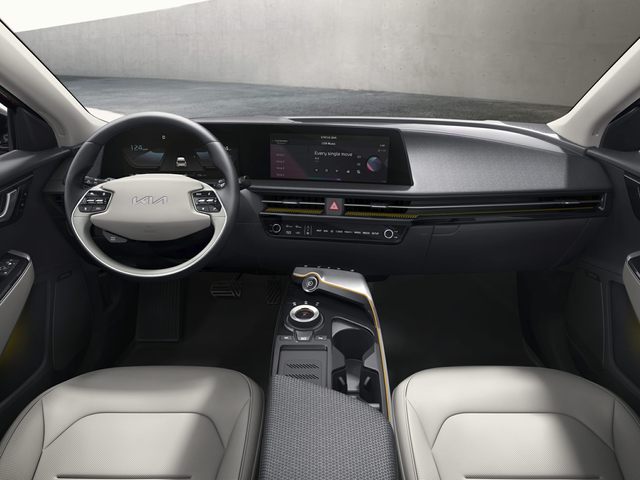 interior of the Kia EV6 including driver's seat, infotainment system and steering wheel