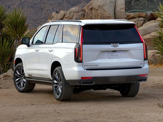 Back-view of a White 2023 Cadillac Escalade in desert setting