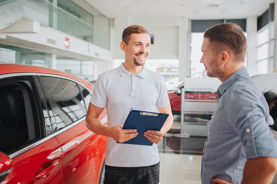 Serramonte Subaru team member helping a customer with a trade-in appraisal