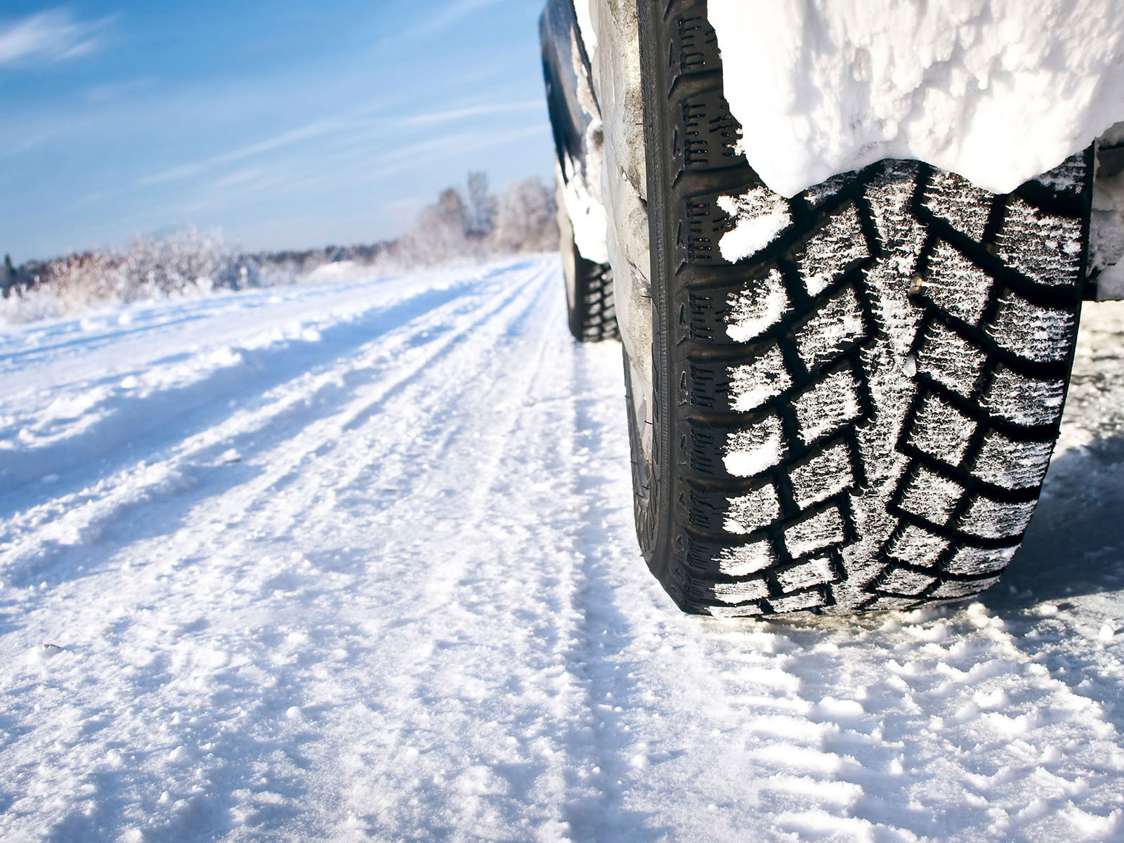 Car tire driving in snow