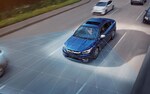 A 2021 Subaru Legacy driving on a highway.