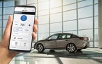 A close-up of a smartphone showing the Remote Engine Start with Climate Control feature available on the 2021 Subaru Legacy.