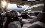A 2021 Subaru Legacy driving on a country road.