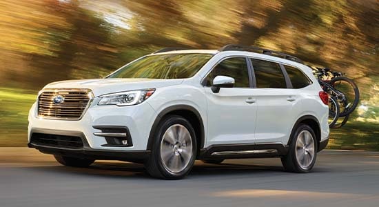 The 2022 Subaru Ascent driving on a road