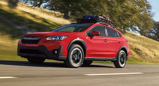 The 2021 Subaru Crosstrek driving on a road