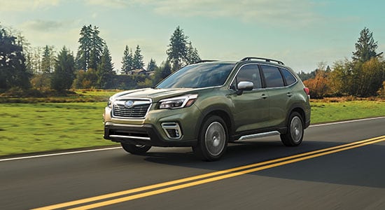 The 2021 Subaru Forester driving on a road
