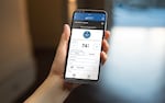 A smartphone showing the Remote Engine Start with Climate Control feature of SUBARU STARLINK® Safety and Security.