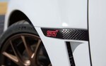 Close up view of Subaru WRX STI Series.White front fender STI badge with black accents