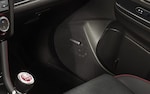 A close-up of a speaker in the Harman Kardon premium audio system.