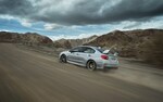 The 2020 WRX STI taking a corner on a race track.