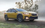 A 2021 Subaru Crosstrek Sport on a country road.