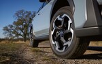A close-up of the front wheel and 8.7 inches of ground clearance of the 2021 Subaru Crosstrek.