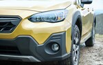 A close-up highlighting the exclusive exterior design of the grille, moldings, and wheels on the 2021 Subaru Crosstrek Sport.