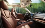 A photo showing the front seats of the spacious interior inside the 2021 Subaru Forester.