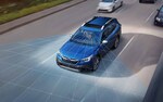 A photo illustration showing the EyeSight® Driver Assist Technology sensors on a 2021 Subaru Outback driving down a highway.