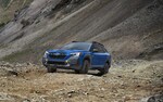 2022 Outback Wilderness in Geyser Blue parked on a rocky road.