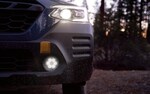 The front of a Subaru Outback focussing on the lights